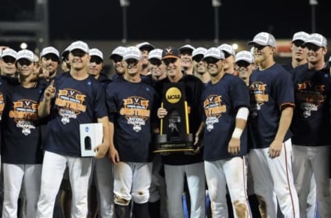 Jun 24, 2015; Omaha, NE, USA; The Virginia Cavaliers celebrate with the NCAA championship trophy after defeating the Vanderbilt Commodores in game three of the College World Series Final at TD Ameritrade Park. Virginia defeated Vanderbilt 4-2 to win the College World Series. Mandatory Credit: Steven Branscombe-USA TODAY Sports