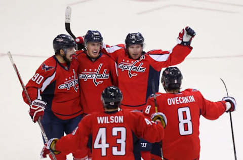 NHL Power Rankings: Washington Capitals center Nicklas Backstrom (19) celebrates with teammates after scoring the game-winning goal in overtime against the Boston Bruins at Verizon Center. The Capitals won 4-3 in overtime. Mandatory Credit: Geoff Burke-USA TODAY Sports