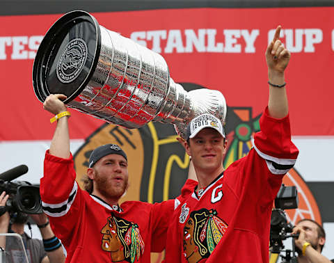 CHICAGO, IL – JUNE 18: Patrick Kane #88 (L) and Jonathan Toews #19 of the Chicago Blackhawksacknowlegde the crowd during the Chicago Blackhawks Stanley Cup Championship Rally at Soldier Field on June 18, 2015 in Chicago, Illinois. (Photo by Jonathan Daniel/Getty Images)