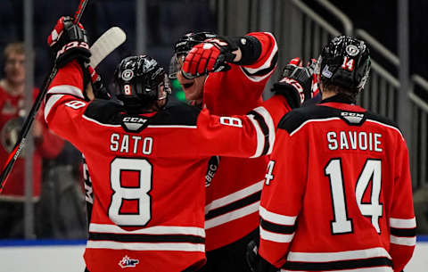 QUEBEC CITY, QC – OCTOBER 26: Yu Sato #8, Thomas Caron #26 and Nicolas Savoie #14 of the Quebec Remparts celebrate their victory against the Shawinigan Cataractes during their QMJHL hockey game at the Videotron Center on October 26, 2019 in Quebec City, Quebec, Canada. (Photo by Mathieu Belanger/Getty Images)