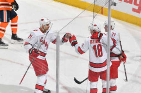 EDMONTON, AB – DECEMBER 10: Nino Niederreiter #21, Ryan Dzingel #18 and Lucas Wallmark #71 of the Carolina Hurricanes celebrate after a goal during the game against the Edmonton Oilers on December 10, 2019, at Rogers Place in Edmonton, Alberta, Canada. (Photo by Andy Devlin/NHLI via Getty Images)