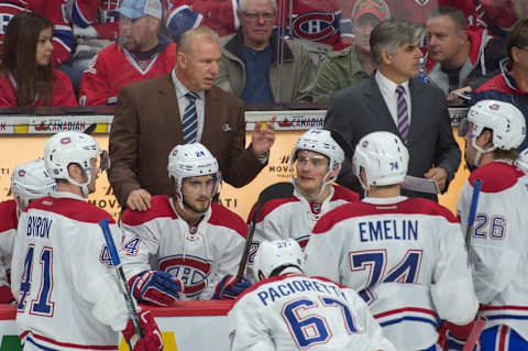 Oct 15, 2016; Ottawa, Ontario, CAN; Montreal Canadiens head coach Michel Therrien speaks to his team in the third period against the Ottawa Senators at the Canadian Tire Centre. The Senators defeated the Canadiens 4-3 in a shootout. Mandatory Credit: Marc DesRosiers-USA TODAY Sports