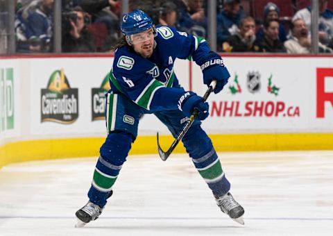 VANCOUVER, BC – DECEMBER 10: Christopher Tanev #8 of the Vancouver Canucks shoots the puck during NHL action at Rogers Arena against the Toronto Maple Leafs on December 10, 2019 in Vancouver, Canada. (Photo by Rich Lam/Getty Images)