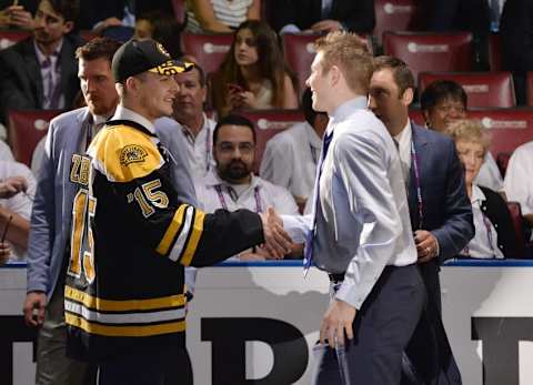 Jun 26, 2015; Sunrise, FL, USA; Jake Debrusk (right) shakes hands with fellow Boston draft pick Jakub Zboril (left) after being selected as the number fourteen overall pick to the Boston Bruins in the first round of the 2015 NHL Draft at BB&T Center. Mandatory Credit: Steve Mitchell-USA TODAY Sports