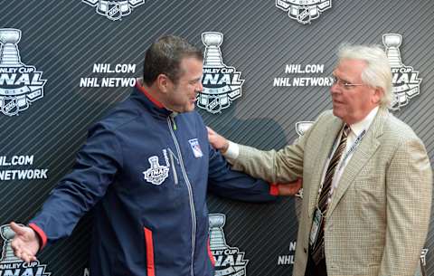 Jun 3, 2014; Los Angeles, CA, USA; New York Rangers coach Alain Vigneault (left) greets general manager Glen Sather during media day before game one of the 2014 Stanley Cup Final against the Los Angeles Kings at Staples Center. Mandatory Credit: Kirby Lee-USA TODAY Sports