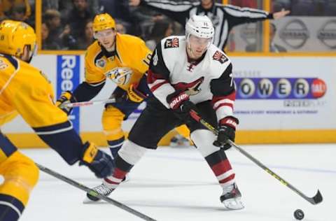 Apr 7, 2016; Nashville, TN, USA; Arizona Coyotes center Laurent Dauphin (76) skates the puck into the offensive zone during the second period against the Nashville Predators at Bridgestone Arena. Mandatory Credit: Christopher Hanewinckel-USA TODAY Sports