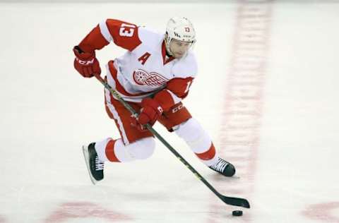 Apr 2, 2016; Toronto, Ontario, CAN; Detroit Red Wings center Pavel Datsyuk (13) skates with the puck against the Toronto Maple Leafs at Air Canada Centre. The Red Wings beat the Maple Leafs 3-2. Mandatory Credit: Tom Szczerbowski-USA TODAY Sports