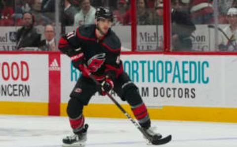 Mar 5, 2023; Raleigh, North Carolina, USA; Carolina Hurricanes defenseman Shayne Gostisbehere (41) skates with the puck against the Tampa Bay Lightning during the third period at PNC Arena. Mandatory Credit: James Guillory-USA TODAY Sports