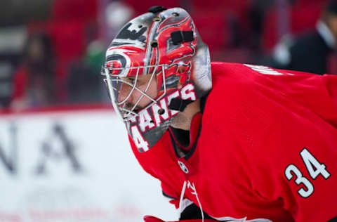 Apr 4, 2021; Raleigh, North Carolina, USA; Carolina Hurricanes goaltender Petr Mrazek (34) looks on during he game against the Dallas Stars at PNC Arena. Mandatory Credit: James Guillory-USA TODAY Sports