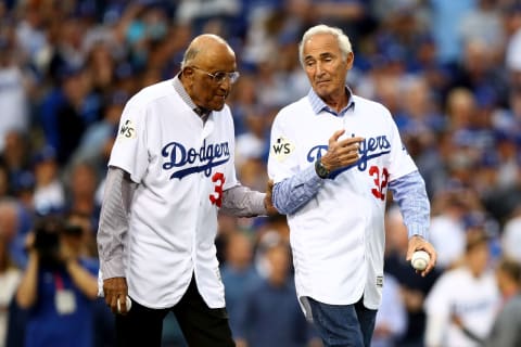 LOS ANGELES, CA – NOVEMBER 01: Former Los Angeles Dodgers players Don Newcombe and Sandy Koufax walk on the field for the ceremonial first pitch before game seven of the 2017 World Series between the Houston Astros and the Los Angeles Dodgers at Dodger Stadium on November 1, 2017 in Los Angeles, California. (Photo by Ezra Shaw/Getty Images)