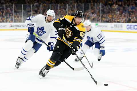 BOSTON, MASSACHUSETTS – APRIL 23: Sean Kuraly #52 of the Boston Bruins skates against Auston Matthews #34 and Travis Dermott #23 during the first period Game Seven of the Eastern Conference First Round during the 2019 NHL Stanley Cup Playoffs at TD Garden on April 23, 2019 in Boston, Massachusetts. (Photo by Maddie Meyer/Getty Images)