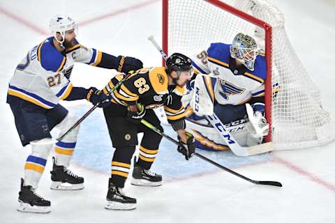 BOSTON, MA – JUNE 12: Boston Bruins left wing Brad Marchand (63) gets a hit from behind St. Louis Blues defenseman Alex Pietrangelo (27) in front of the net. During Game 7 of the Stanley Cup Finals featuring the Boston Bruins against the St. Louis Blues on June 12, 2019 at TD Garden in Boston, MA. (Photo by Michael Tureski/Icon Sportswire via Getty Images)