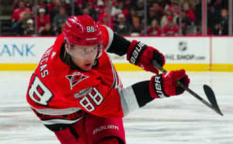 Apr 25, 2023; Raleigh, North Carolina, USA; Carolina Hurricanes center Martin Necas (88) shoots against the New York Islanders during the third period in game five of the first round of the 2023 Stanley Cup Playoffs at PNC Arena. Mandatory Credit: James Guillory-USA TODAY Sports