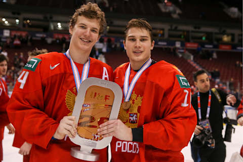 VANCOUVER, CANADA JANUARY 5, 2019: Russia’s Vitaly Kravtsov (L) and Pavel Shen pose with the trophy after winning their 2019 IIHF World Junior Championships bronze medal ice hockey match against Switzerland at Rogers Arena. Andrew Chan/TASS (Photo by Andrew ChanTASS via Getty Images)