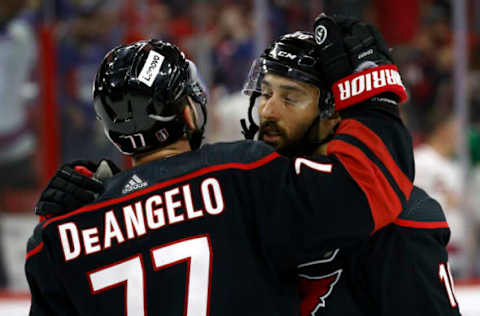 RALEIGH, NORTH CAROLINA – MAY 30: Tony DeAngelo #77 and Vincent Trocheck #16 of the Carolina Hurricanes react following their 6-2 defeat against the New York Rangers in Game Seven of the Second Round of the 2022 Stanley Cup Playoffs at PNC Arena on May 30, 2022, in Raleigh, North Carolina. (Photo by Jared C. Tilton/Getty Images)