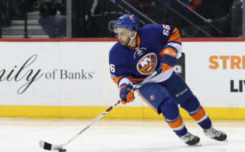 New York Islanders right wing Joshua Ho-Sang (66) carries the puck in Islanders Blue and Orange (Anthony Gruppuso-USA TODAY Sports)