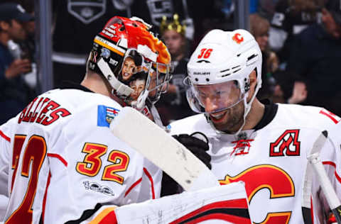 LOS ANGELES, CA – APRIL 6: Troy Brouwer #36 of the Calgary Flames congratulates Jon Gillies #32 after their win. (Photo by Juan Ocampo/NHLI via Getty Images)