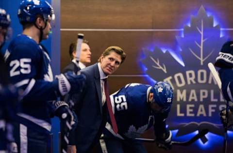 TORONTO, ON – JANUARY 22: Mike Babcock of the Toronto Maple Leafs looks out of the dressing room as the Leafs wait to take the ice for the second period of play against the Colorado Avalanche at the Air Canada Centre on January 22, 2018 in Toronto, Ontario, Canada. (Photo by Kevin Sousa/NHLI via Getty Images)