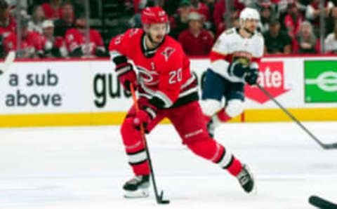 May 20, 2023; Raleigh, North Carolina, USA; Carolina Hurricanes center Sebastian Aho (20) pushes the puck up the ice against the Florida Panthers in game two of the Eastern Conference Finals of the 2023 Stanley Cup Playoffs at PNC Arena. Mandatory Credit: James Guillory-USA TODAY Sports