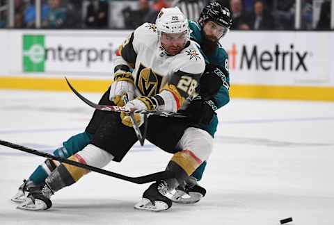 SAN JOSE, CA – APRIL 10: William Carrier #28 of the Vegas Golden Knights controls the puck keeping it away from Brent Burns #88 of the San Jose Sharks during the third period in Game One of the Western Conference First Round during the 2019 NHL Stanley Cup Playoffs at SAP Center on April 10, 2019 in San Jose, California. The Sharks won the game 5-2. (Photo by Thearon W. Henderson/Getty Images)