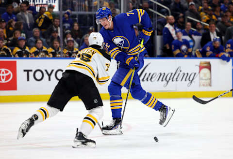 Mar 19, 2023; Buffalo, New York, USA; Buffalo Sabres center Tage Thompson (72) makes a pass asBoston Bruins defenseman Connor Clifton (75) defends during the second period at KeyBank Center. Mandatory Credit: Timothy T. Ludwig-USA TODAY Sports