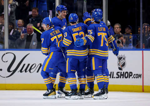 Nov 10, 2023; Buffalo, New York, USA; Buffalo Sabres right wing JJ Peterka (77) celebrates his goal with teammates during the third period against the Minnesota Wild at KeyBank Center. Mandatory Credit: Timothy T. Ludwig-USA TODAY Sports