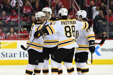 NHL Power Rankings: Boston Bruins left wing Brad Marchand (63) is congratulated by teammates after scoring a goal against the Washington Capitals during the second period at Verizon Center. Mandatory Credit: Brad Mills-USA TODAY Sports