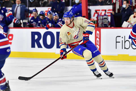 LAVAL, QC – APRIL 08: Nate Schnarr #38 of the Laval Rocket skates the puck against the Rochester Americans during the second period at Place Bell on April 8, 2022 in Laval, Canada. The Laval Rocket defeated the Rochester Americans 4-3 in overtime. (Photo by Minas Panagiotakis/Getty Images)