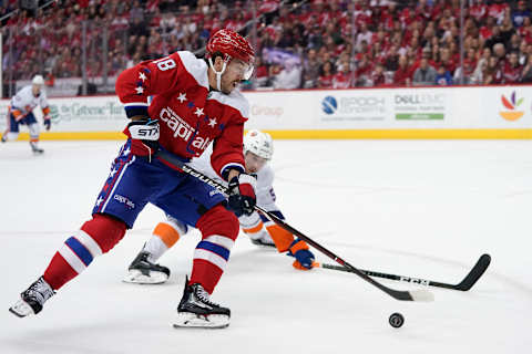 WASHINGTON, DC – APRIL 06: Chandler Stephenson #18 of the Washington Capitals skates with the puck against Johnny Boychuk #55 of the New York Islanders in the first period at Capital One Arena on April 6, 2019 in Washington, DC. (Photo by Patrick McDermott/NHLI via Getty Images)