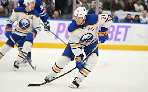 Nov 4, 2023; Toronto, Ontario, CAN; Buffalo Sabres forward Kyle Okposo (21) pursues the play against the Toronto Maple Leafs in the third period at Scotiabank Arena. Mandatory Credit: Dan Hamilton-USA TODAY Sports