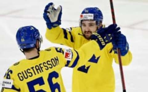 Sweden’s defender Erik Gustafsson and Sweden’s forward Emil Bemstrom celebrate a goal during the 2022 IIHF Ice Hockey World Championships preliminary round group B match between Czech Republic and Sweden in Tampere on May 15, 2022. – – Finland OUT (Photo by Vesa Moilanen / Lehtikuva / AFP) / Finland OUT (Photo by VESA MOILANEN/Lehtikuva/AFP via Getty Images)