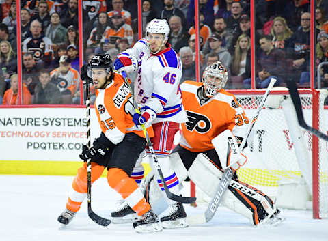 Jan 4, 2017; Philadelphia, PA, USA; Philadelphia Flyers defenseman Michael Del Zotto (15) battles with New York Rangers left wing Marek Hrivik (46) in front of goalie Steve Mason (35) during the first period at Wells Fargo Center. Mandatory Credit: Eric Hartline-USA TODAY Sports