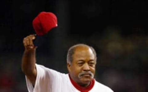 BOSTON – OCTOBER 13: Former Boston Red Sox Luis Tiant acknowledges the crowd before throwing out the first pitch to start Game 4 of the 2003 American League Championship Series against the New York Yankees October 13, 2003 at Fenway Park in Boston, Massachusetts. (Photo by Ezra Shaw/Getty Images)