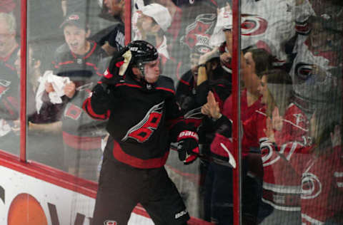 RALEIGH, NC – MAY 03: Carolina Hurricanes right wing Andrei Svechnikov (37) jumps into the boards in celebration after scoring during a game between the Carolina Hurricanes and the New York Islanders on March 3, 2019 at the PNC Arena in Raleigh, NC. (Photo by Greg Thompson/Icon Sportswire via Getty Images)