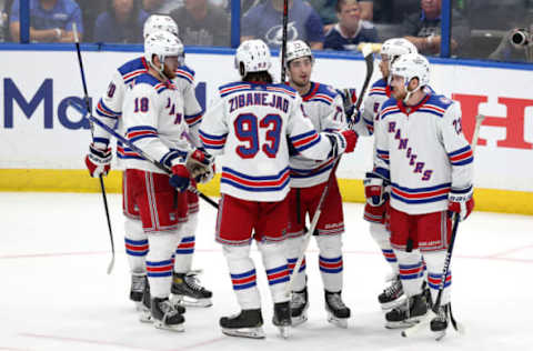 TAMPA, FLORIDA – JUNE 07: Artemi Panarin #10 of the New York Rangers celebrates with his teammates after scoring a goal on Andrei Vasilevskiy #88 of the Tampa Bay Lightning during the third period in Game Four of the Eastern Conference Final of the 2022 Stanley Cup Playoffs at Amalie Arena on June 07, 2022, in Tampa, Florida. (Photo by Mike Carlson/Getty Images)