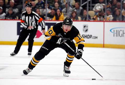 Nov 11, 2023; Pittsburgh, Pennsylvania, USA; Pittsburgh Penguins left wing Drew O’Connor (10) skates with the puck against the Buffalo Sabres at PPG Paints Arena. Mandatory Credit: Charles LeClaire-USA TODAY Sports