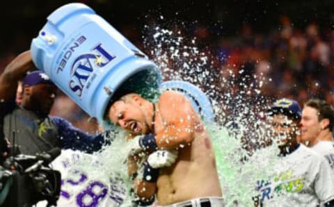 ST PETERSBURG, FLORIDA – SEPTEMBER 21: Nate Lowe #35 of the Tampa Bay Rays gets a water cooler bath after a 2-run walk-off against the Boston Red Sox in the eleventh inning of a baseball game at Tropicana Field on September 21, 2019 in St Petersburg, Florida. (Photo by Julio Aguilar/Getty Images)