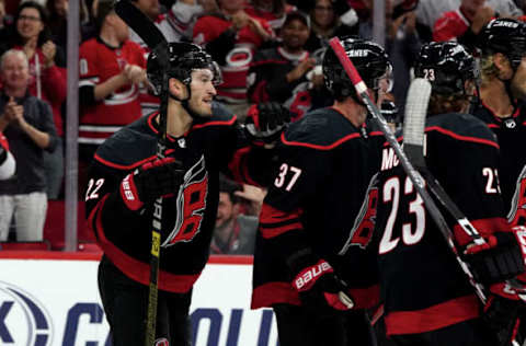 RALEIGH, NC – OCTOBER 11: Brett Pesce #22 of the Carolina Hurricanes celebrates with teammates after scoring a goal during an NHL game against the New York Islanders on October 11, 2019 at PNC Arena in Raleigh North Carolina. (Photo by Gregg Forwerck/NHLI via Getty Images)