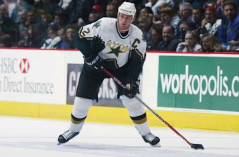 VANCOUVER – OCTOBER 26: Derian Hatcher#2 of the Dallas Stars has control of the puck during the game against the Vancouver Canucks at General Motors Place on October 26, 2002 in Vancouver, British Columbia. (Photo by Jeff Vinnick/Getty Images/NHLI)