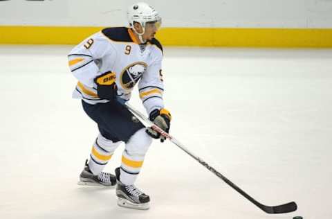 February 24, 2016; Anaheim, CA, USA; Buffalo Sabres left wing Evander Kane (9) moves the puck against Anaheim Ducks during the second period at Honda Center. Mandatory Credit: Gary A. Vasquez-USA TODAY Sports