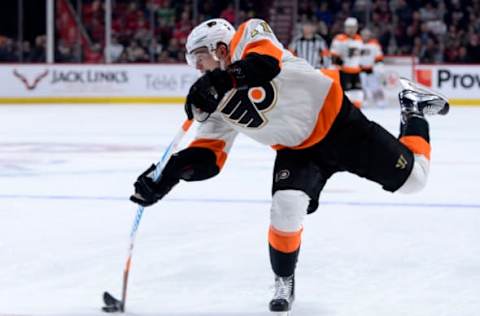 Nov 5, 2016; Montreal, Quebec, CAN; Philadelphia Flyers forward Travis Konecny (11) takes a shot on net during the third period of the game against the Montreal Canadiens at the Bell Centre. Mandatory Credit: Eric Bolte-USA TODAY Sports