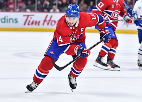 MONTREAL, CANADA – JANUARY 21: Nick Suzuki #14 of the Montreal Canadiens skates during the second period against the Toronto Maple Leafs at Centre Bell on January 21, 2023 in Montreal, Quebec, Canada. The Montreal Canadiens defeated the Toronto Maple Leafs 3-2 in overtime. (Photo by Minas Panagiotakis/Getty Images)