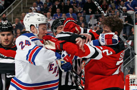 NEWARK, NEW JERSEY – APRIL 27: Kaapo Kakko #24 of the New York Rangers and Damon Severson #28 of the New Jersey Devils exchange pushes during the first period in Game Five of the First Round of the 2023 Stanley Cup Playoffs at Prudential Center on April 27, 2023, in Newark, New Jersey. (Photo by Bruce Bennett/Getty Images)