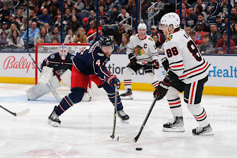 Dec 31, 2022; Columbus, Ohio, USA; Chicago Blackhawks right wing Patrick Kane (88) looks to pass as Columbus Blue Jackets defenseman Vladislav Gavrikov (4) defends during the second period at Nationwide Arena. Mandatory Credit: Russell LaBounty-USA TODAY Sports