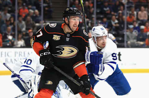 ANAHEIM, CA – NOVEMBER 16: Nick Ritchie #37 of the Anaheim Ducks is pushed by Igor Ozhiganov #92 of the Toronto Maple Leafs during the first period of a game at Honda Center on November 16, 2018, in Anaheim, California. (Photo by Sean M. Haffey/Getty Images)