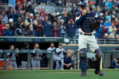 MINNEAPOLIS, MN – SEPTEMBER 30: Joe Mauuer #7 of the Minnesota Twins acknowledges the fans as walks onto the field to catch at the start of the ninth inning against the Chicago White Sox during the game on September 30, 2018 at Target Field in Minneapolis, Minnesota. (Photo by Hannah Foslien/Getty Images)