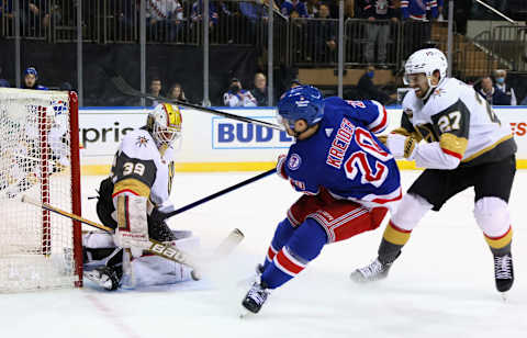 NEW YORK, NEW YORK – DECEMBER 17: Laurent Brossoit #39 of the Vegas Golden Knights makes the overtime save on Chris Kreider #20 of the New York Rangers at Madison Square Garden on December 17, 2021 in New York City. The Golden Knights defeated the Rangers 3-2 in the shootout. (Photo by Bruce Bennett/Getty Images)