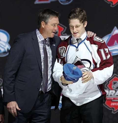 Jun 30, 2013; Newark, NJ, USA; Nathan MacKinnon is congratulated by Colorado Avalanche head coach Patrick Roy after being introduced as the number one overall pick to the Colorado Avalanche during the 2013 NHL Draft at the Prudential Center. Mandatory Credit: Ed Mulholland-USA TODAY Sports