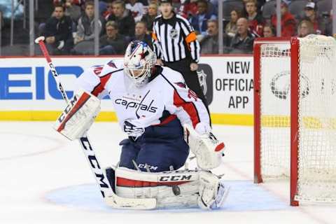 Feb 6, 2016; Newark, NJ, USA; Washington Capitals goalie Braden Holtby (70) makes a save during the first period of their game against the New Jersey Devils at Prudential Center. Mandatory Credit: Ed Mulholland-USA TODAY Sports