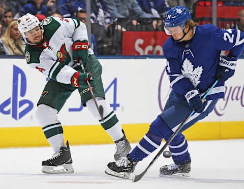 TORONTO, ON – OCTOBER 15: Matt Dumba #24 of the Minnesota Wild battles against Kasperi Kapanen #24 of the Toronto Maple Leafs during an NHL game at Scotiabank Arena on October 15, 2019 in Toronto, Ontario, Canada. The Maple Leafs defeated the Wild 4-2. (Photo by Claus Andersen/Getty Images)